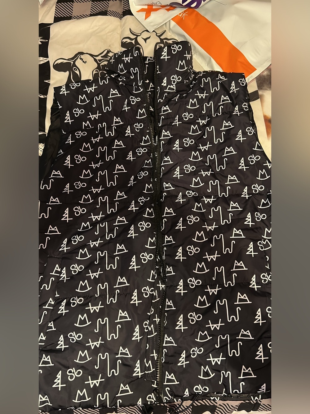 Womens Black vest with cattle brands